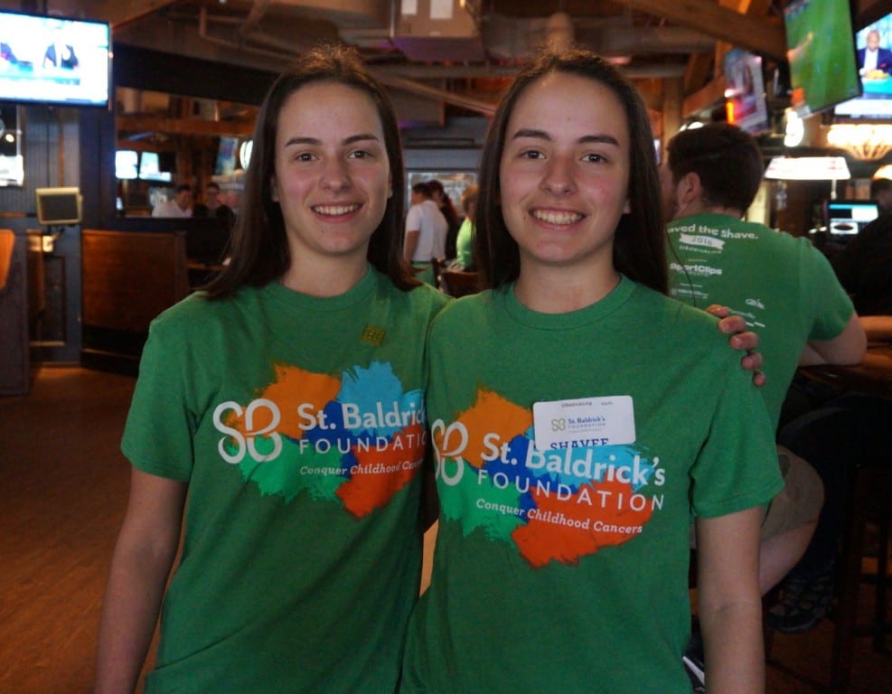 Conard seniors Abby (left) and Kate Gosselin, before having their heads shaved in support of the St. Baldrick's Foundation. Photo credit: Ronni Newton