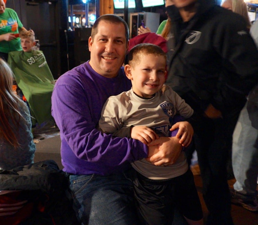 Coach Adam Linker and his son Jeremy both had their hair buzzed in support of the Coaches United Against Cancer and the St. Baldrick's Foundation. Photo credit: Ronni Newton