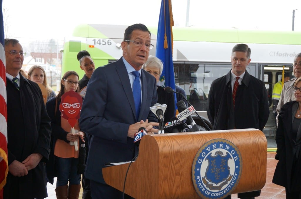 Gov. Dannel P. Malloy marked the one-year anniversary of CTfastrak at the Flatbush Avenue station in West Hartford Monday morning. He is flanked by (from left) DOT Comm. James Redeker, Lt. Gov. Nancy Wyman, West Hartford Mayor Scott Slifka, and West Hartford Deputy Mayor Shari Cantor. In background are individuals who appeared in CTfastrak commercials. Photo credit: Ronni Newton