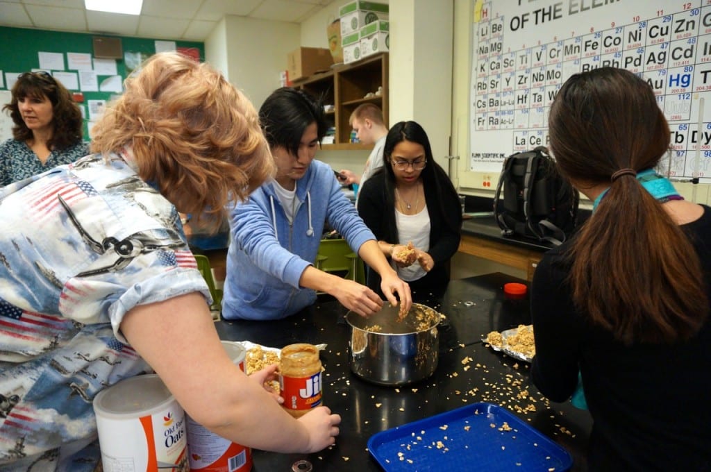 Students in Nicola Culmo's advisory group make peanut butter and oatmeal treats for dogs. Do Something Day. Hall High School. March 9, 2016. Photo credit: Ronni Newton