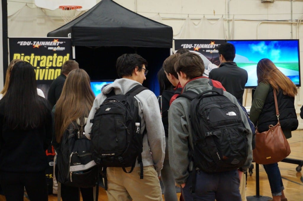 Students line up to try out the distracted driving simulator. Photo credit: Ronni Newton