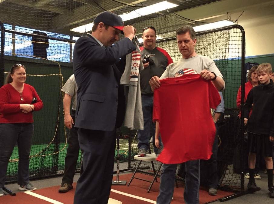 Tim Brennan (right) presents U.S. Sen. Chris Murphy with a team hat and t-shirt at the send-off. Photo credit: Ronni Newton