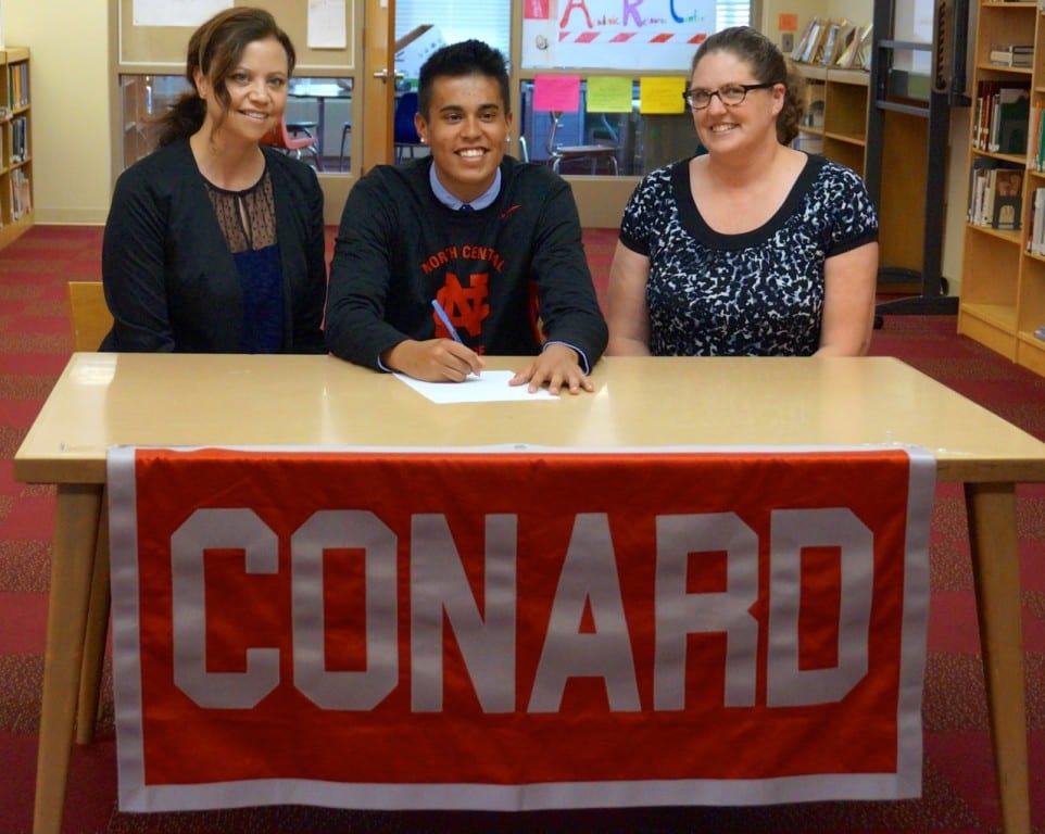 Matt Morales with his mother (left) and volleyball coach Kerry Roller. Photo credit: Ronni Newton