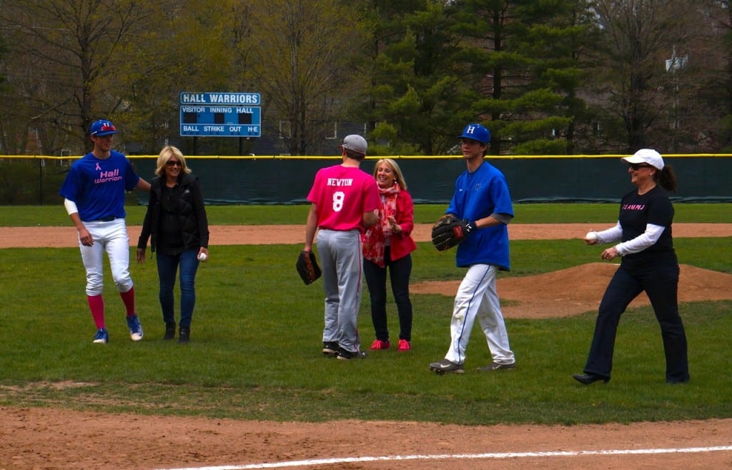 Hall team member RJ Michaels played in honor of survivor Patty Fox (left) who threw a ball to Hall's Danny Roth. Survivor Ronni Newton threw a pitch to her son, Conard's Sam Newton. Survivor Jeanne Pascon threw a pitch to Hall's Derek Berube. Photo credit: Rick Sanfor