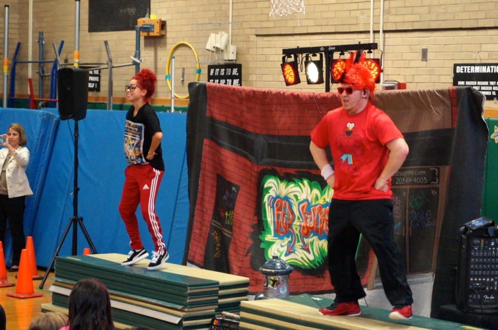 Austin Dailey (right) and J Swag lead the entire school community in a dance. A.C.E.S. day at Smith STEM School, West Hartford. May 4, 2016. Photo credit: Ronni Newton
