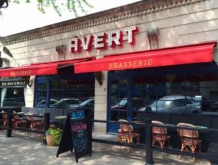 Avert Brasserie has a new sign and retractable awnings to protect outdoor diners from the weather. Photo credit: Ronni Newton
