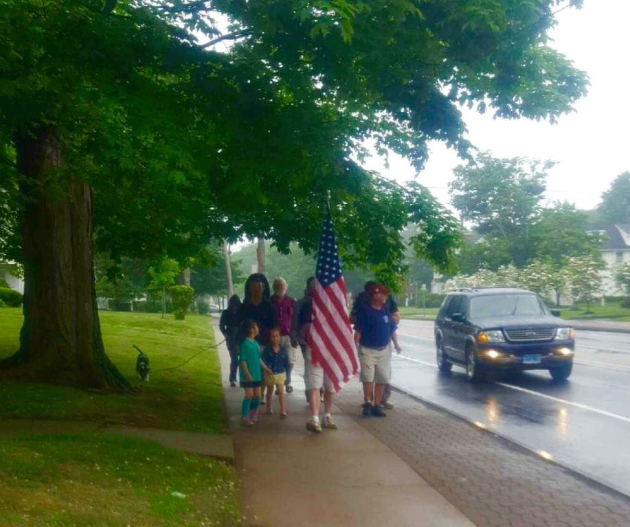 A group of veterans and supporters march in an informal Memorial Day parade down Farmington Avenue in West Hartford after the original parade was canceled due to rain. Photo credit: Debbi Zimbler