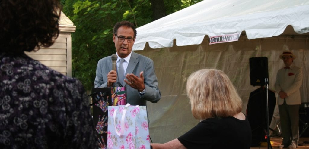 Dr. John F. Rodis, president of Saint Francis Hospital and Medical Center, speaking in West Hartford at Barbara Gordon’s 9th Annual Fundraiser to benefit the Comprehensive Women’s Health Center at Saint Francis Hospital and Medical Center. Barbara is facing him, at right. photo by Joy Taylor
