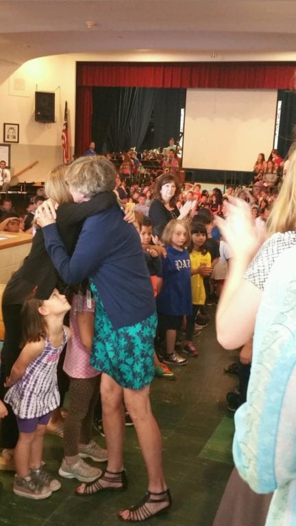 Lots of hugs and a '75 Kindergartner Salute' for Wolcott kindergarten teacher Donna Gosk who retired after 24 years at the school. Photo courtesy of Christine Papadakis