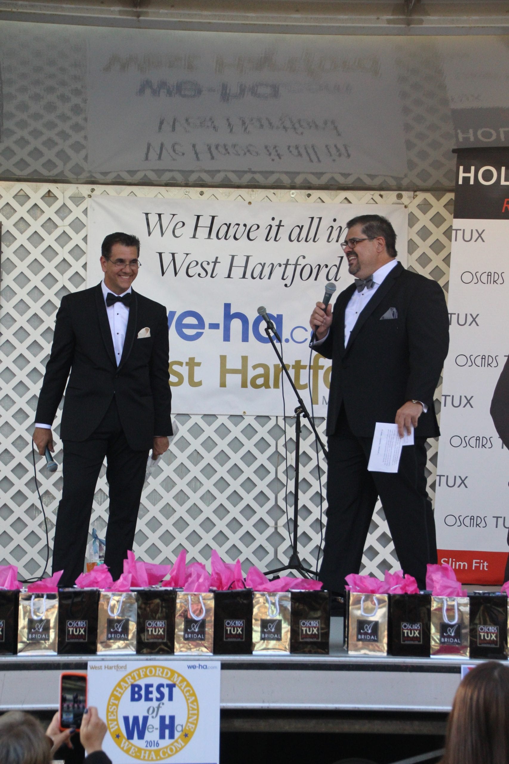 Fashion Show kicks off the Sale Days in West Hartford Center on the Town of West Hartford Showmobile stage on June 23, 2016. Ody Sosa, co-owner of Argelia Novia Bridal and the emcee for Oscars Tux shared the stage. Photo credit: Dylan Carneiro