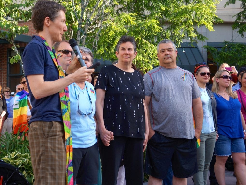 Cathy Rion Starr (left) of the Unitarian Church of Hartford speaks directly to those who came forward as members of the LGBT community. Vigil, June 15, 2016. Photo credit: Ronni Newton