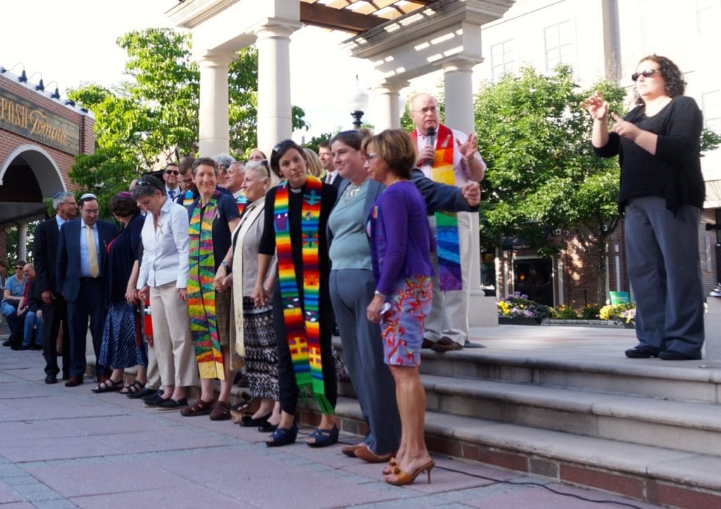 Rev. Geordie Campbell of First Church West Hartford asks the crowd to hold hands. Vigil, June 15, 2016. Photo credit: Ronni Newton