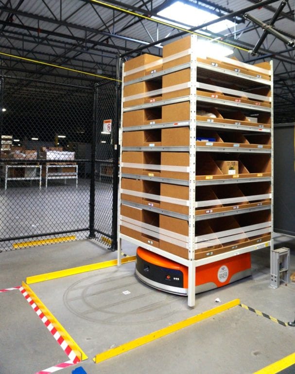 Orange robots transfer product around the floor of the fulfillment center. Photo credit: Ronni Newton
