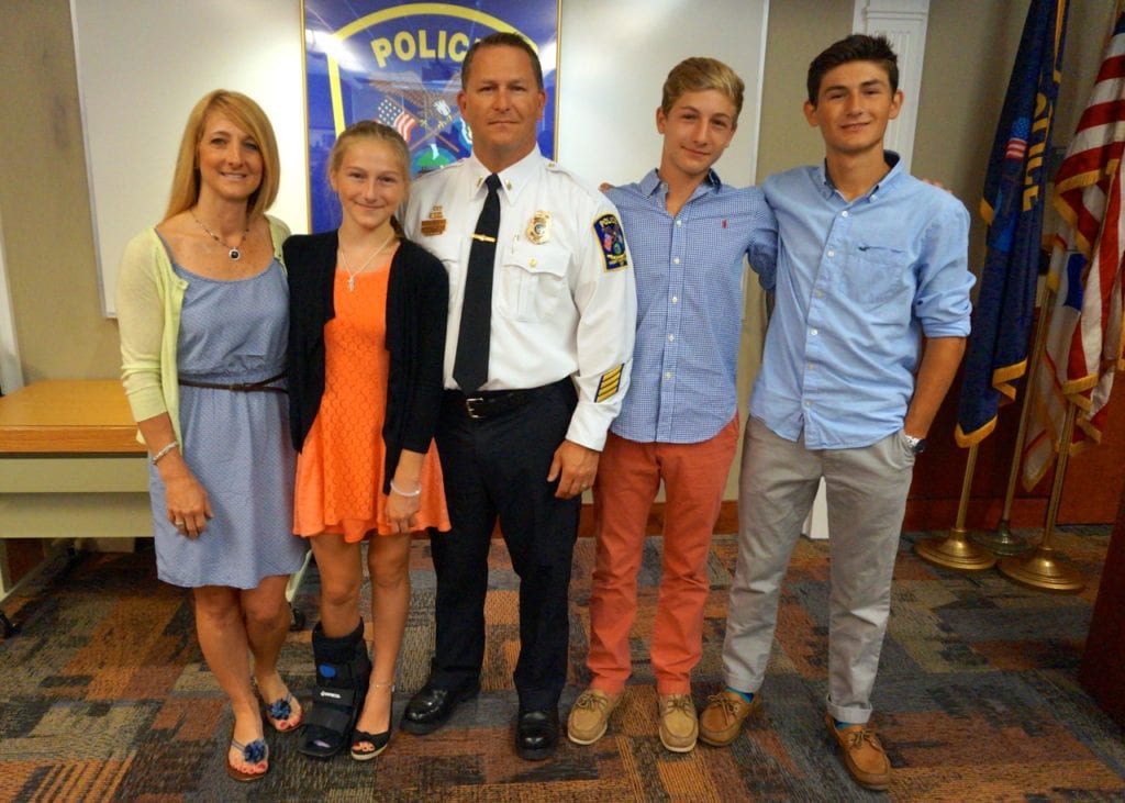 Eric Rocheleau (center) with his wife and children at the promotion ceremony on June 29, 2016. From left: Deb, Grace, Eric, Jake, and Ryan Rocheleau. Photo credit: Ronni Newton  
