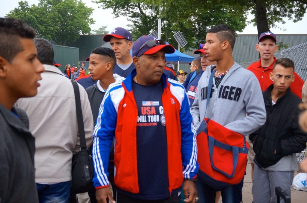 Julio Fernandez and several of the Cuban team members head to the locker room. Photo credit: Ronni Newton