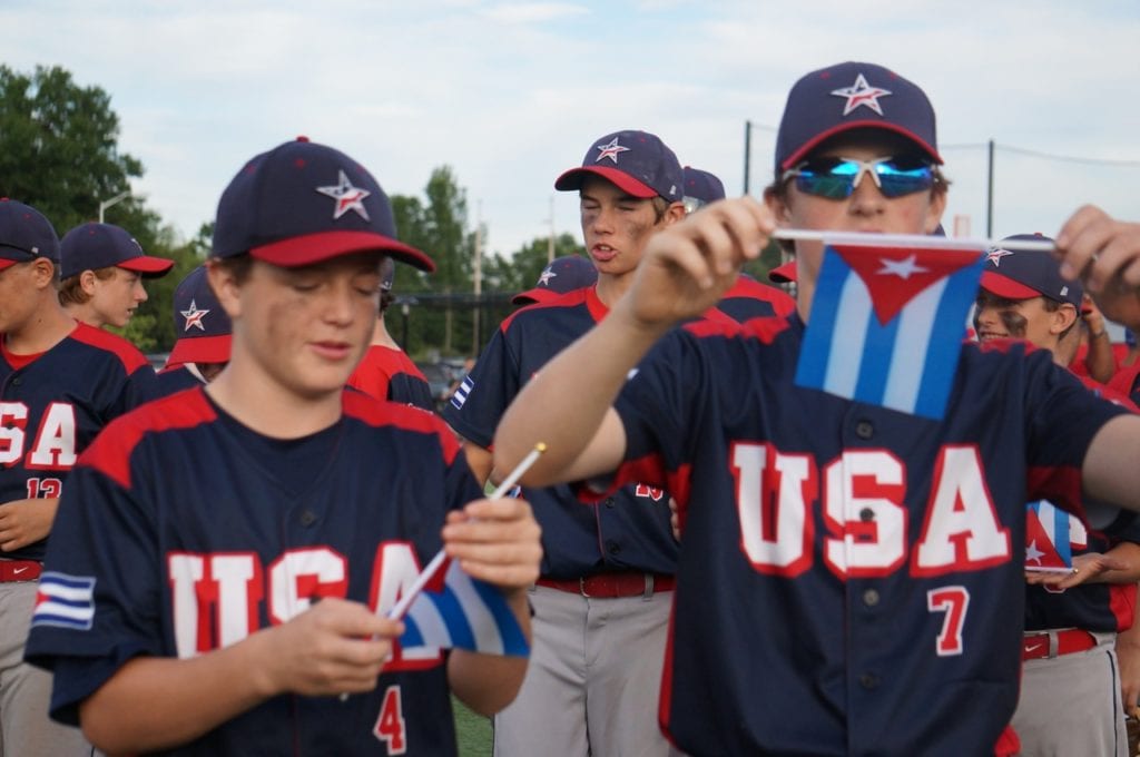 West Hartford's Team USA leaves the opening ceremonies Monday with Cuban flags given to them by Team Cuba. USA-Cuba Goodwill Tour. University of Hartford. July 11, 2016. Photo credit: Ronni Newton