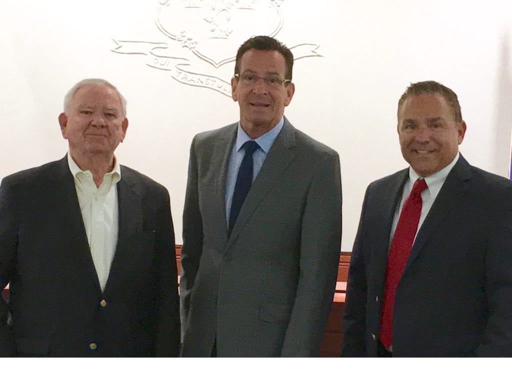 From left: George Howell, Executive Director of the West Hartford Housing Authority and CEO of Trout Brook Realty Advisors, Governor Dannel Malloy and State Representative Joseph Verrengia. Courtesy photo