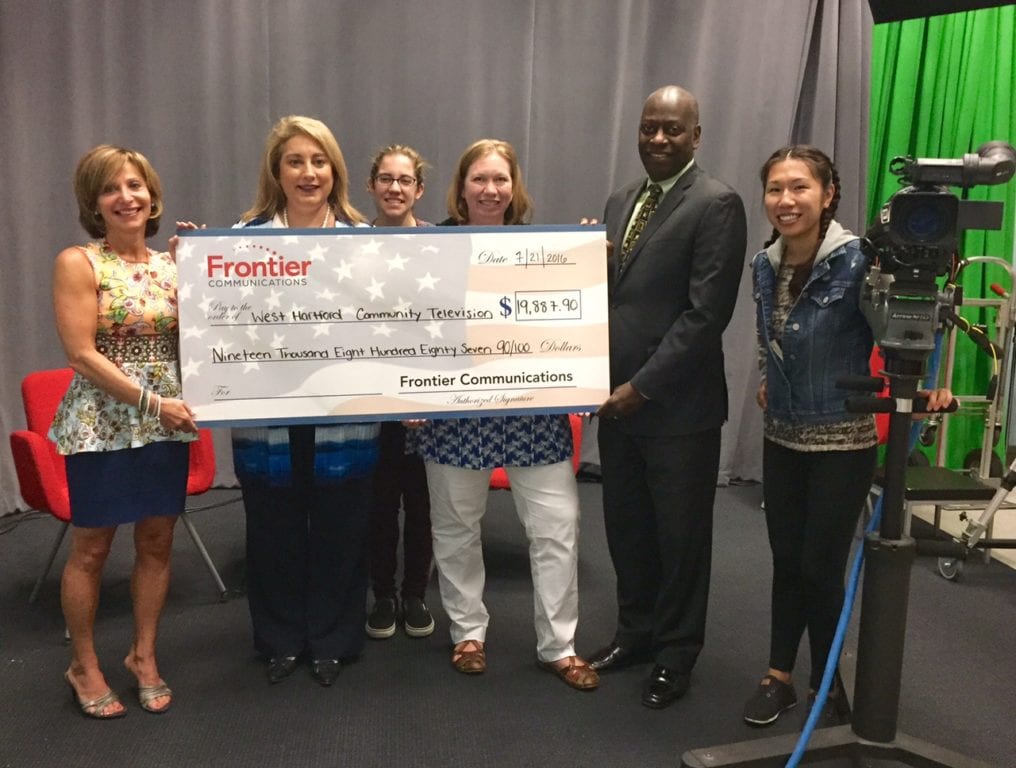 Frontier Communication's grant check for $19,887.90 is presented to WHC-TV on Thursday. From left: West Hartford Mayor Shari Cantor, Frontier Area General Manager Debra Zampano, WHC-TV Director of Legislative Meetings Meredith West, WHC-TV Executive Director Jen Evans; WHC-TV Board President Mark Walker; and WHC-TV Production Coordinator Diana Chin. Photo credit: Ronni Newton