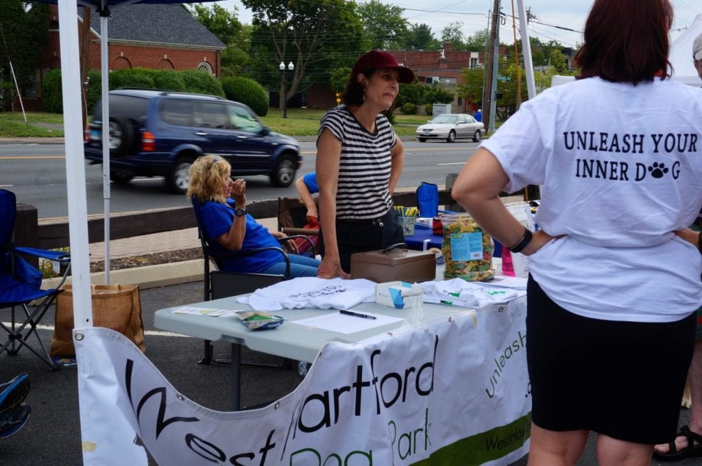 The West Hartford Dog Park Coalition had a booth at the farmers market. Dog Days of Summer at the Farmers' Market at Bishops Corner. Aug. 6, 2016. Photo credit: Ronni Newton