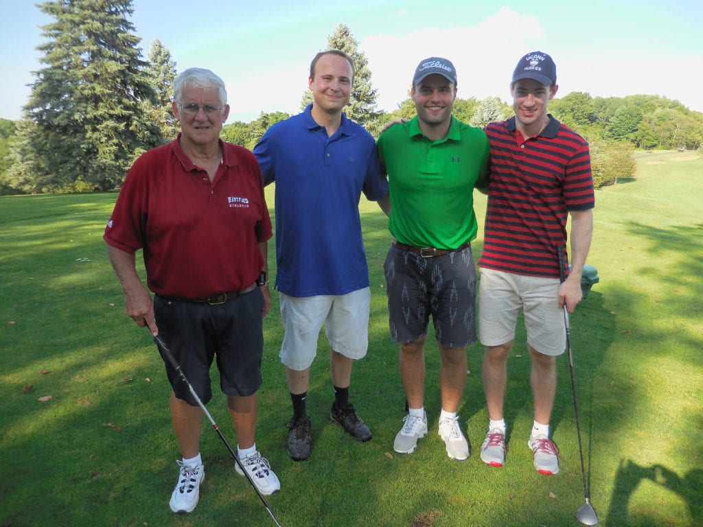 John Hanley (Class of '66) with Eric Christensen (Class of '11), Pat Higgins (Class of '11) and Reid Gustafson (Class of '11). Submitted photo
