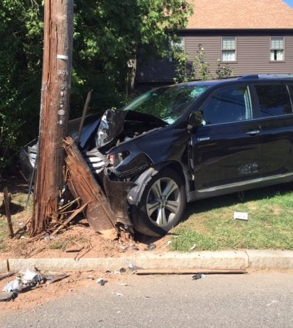 car hits telephone pole