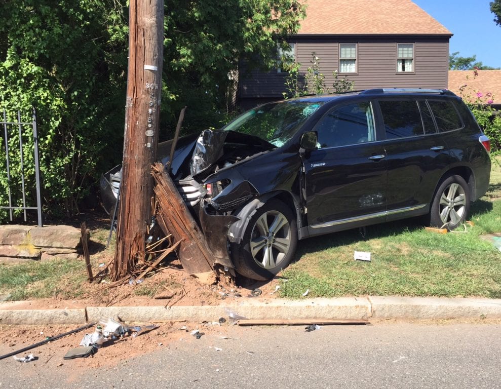 The driver of a Toyota Sienna crashed into a utility pole on South Main Street on Saturday. Photo credit: Ronni Newton