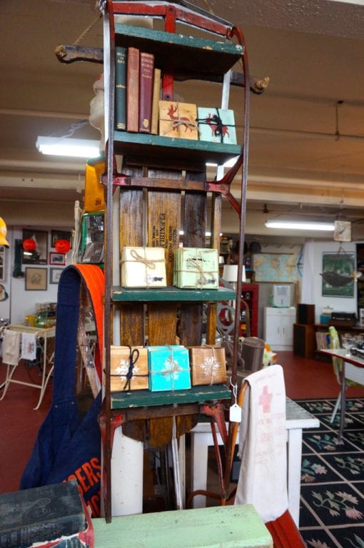 Pat Bronowicki repurposed a Flexible Flyer into a booshelf. Old Crow Vintage sells vintage, antique, and repurposed items. Photo credit: Ronni Newton