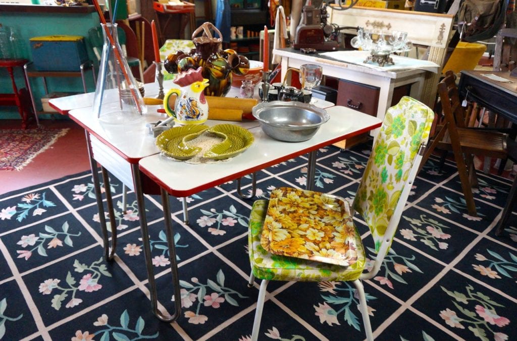 Furniture, dishes, and other items are for sale. Old Crow Vintage sells vintage, antique, and repurposed items. Photo credit: Ronni Newton