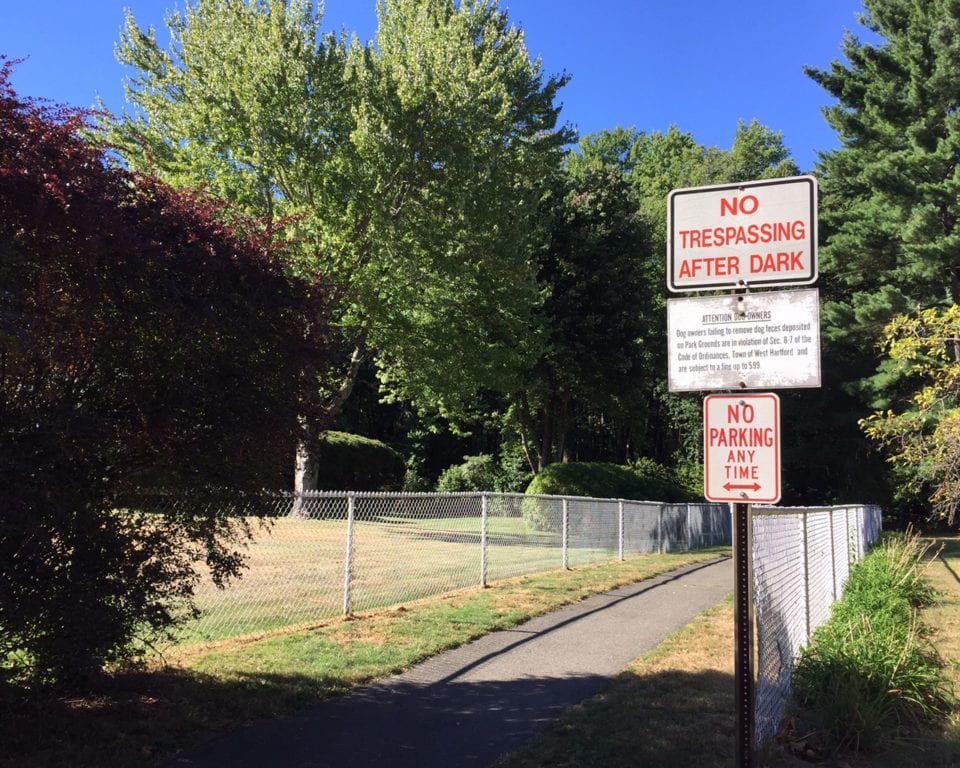 Although the path from Bugbee to Cliffmore Road is cordoned off in the school parking lot, there is nothing posted on the south end of the paved path. Photo credit: Ronni Newton