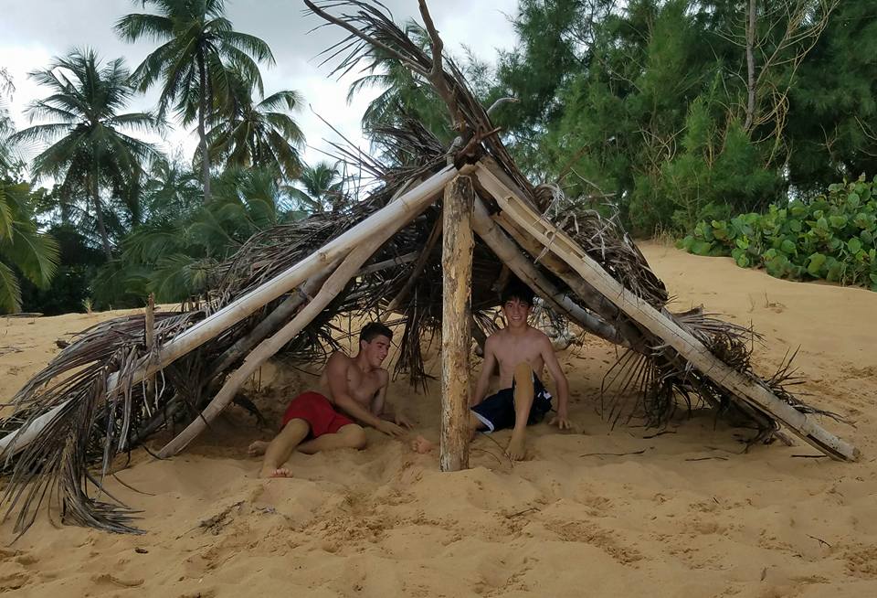 Later that day, Cole Canarie (left) and Aidan Shea resumed their vacation, building a lean-to on the beach for shelter during a thunderstorm. Courtesy photo