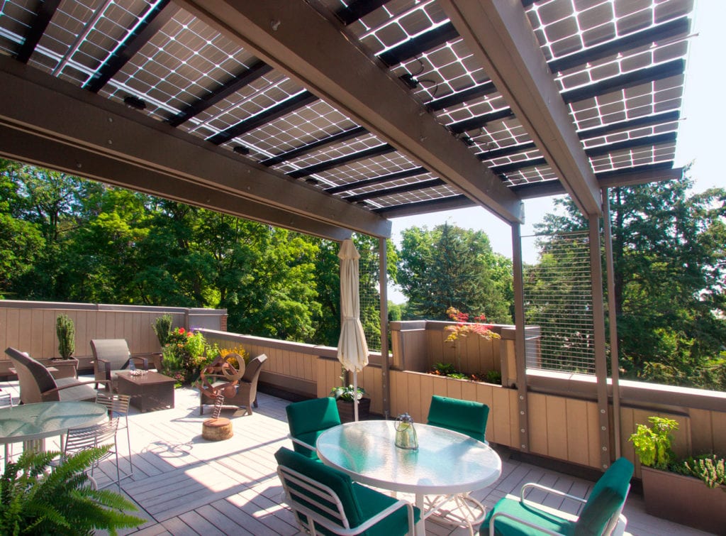The penthouse of a West Hartford condominium belonging to Elizabeth Normen and Paul Eddy has an innovative solar canopy that provides protection from the elements as well as energy. Courtesy photo