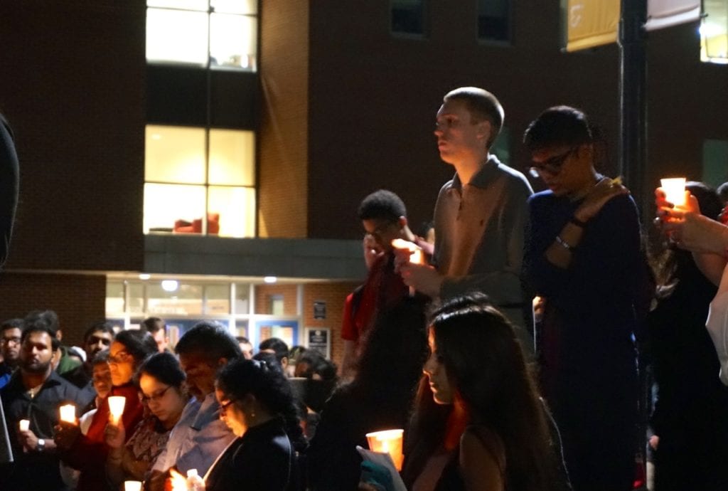 Family and friends of Jeffny Pally, a sophomore from West Hartford killed in an accident Sunday, honor her at a candlelight vigil at UConn Tuesday night. Photo credit: Ronni Newton