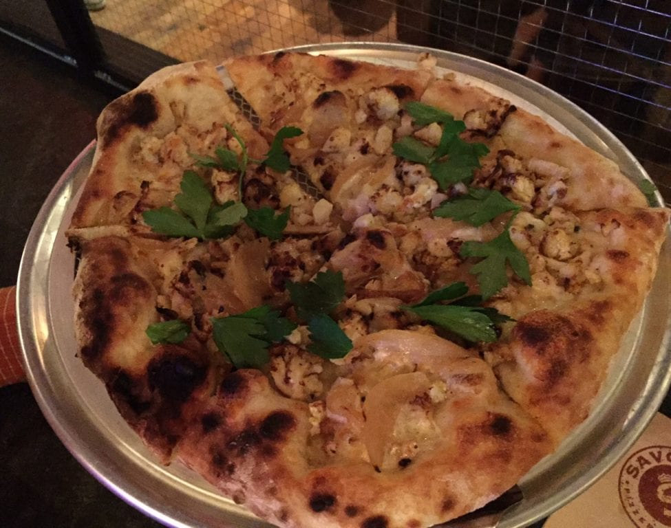 The Flower Power at Savoy is a white pizza with cauliflower, garlic oil, caramelized onions, and breadcrumbs. Photo credit: Ronni Newton