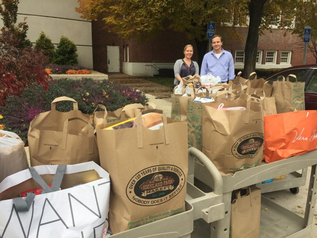 3.Hall High School English Teachers Anna Capobianco and Matthew West pictured with cart loads of donated items for the West Hartford Food Pantry. Submitted photo