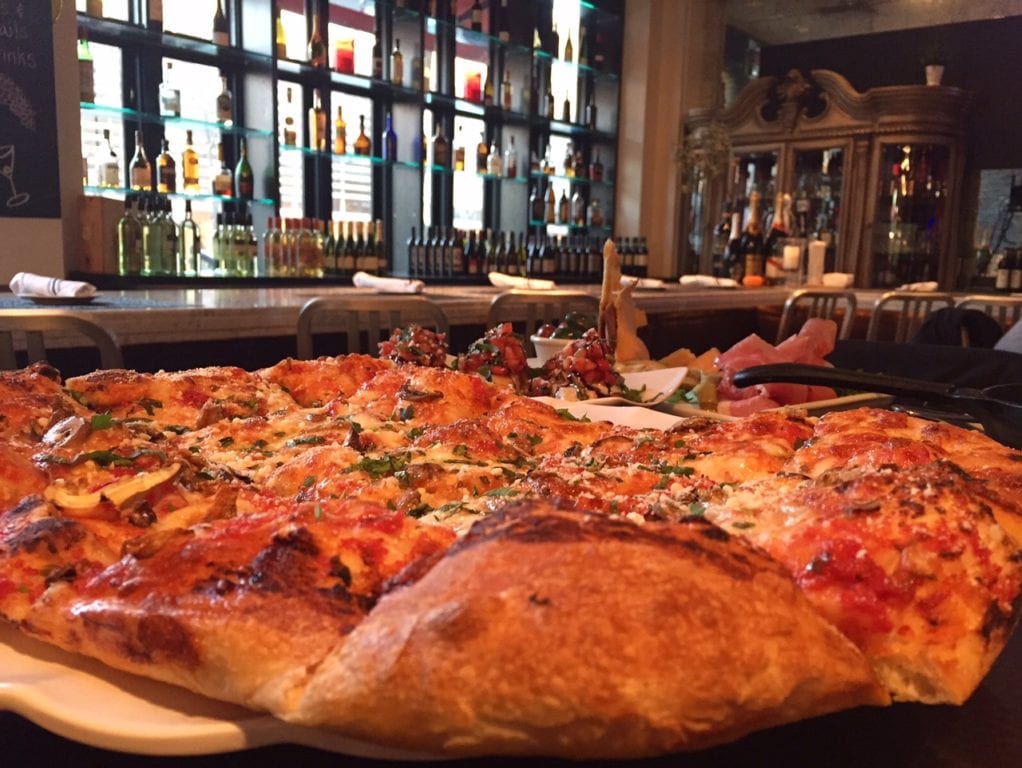 'Grandma's' pizza is on the happy hour menu at Rizzuto's. Photo credit: Ronni Newton