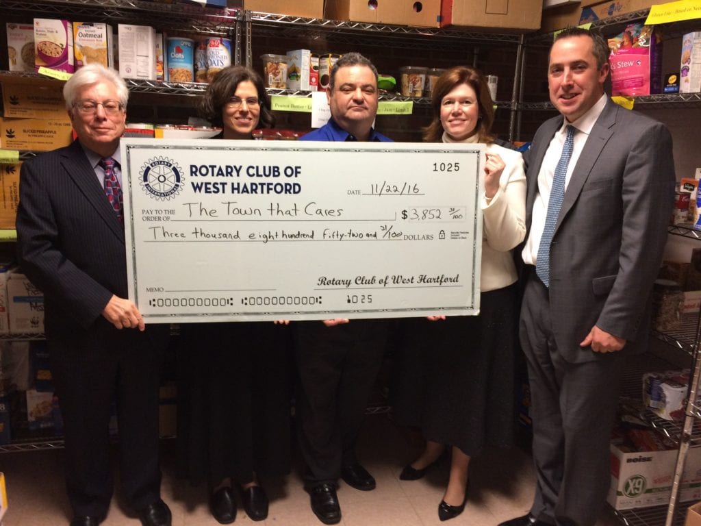 From left: Robert Kor; Suzanne Oslander; Fernando Vidal, Rotary Club/Liberty Bank Thanksgiving Food Drive Chair; Rotary Club of West Hartford Officers Christine Looby and Kyle Egress. Submitted photo