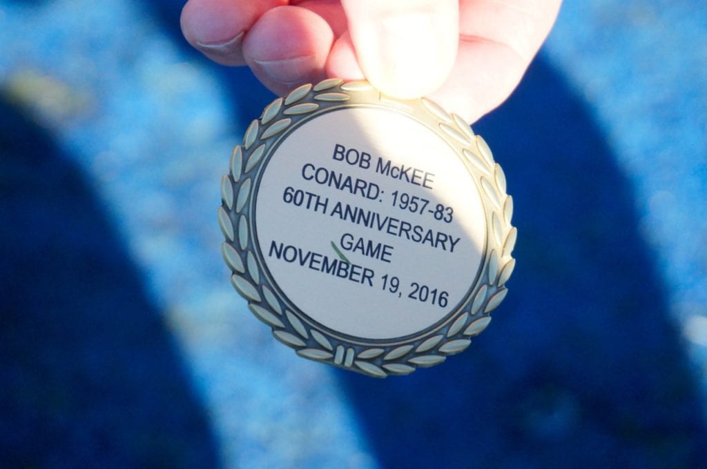 Bob McKee side of commemorative coin used in coin flip. Annual Conard vs. Hall West Hartford Mayor’s Cup football game. Nov. 19, 2016. Photo credit: Ronni Newton