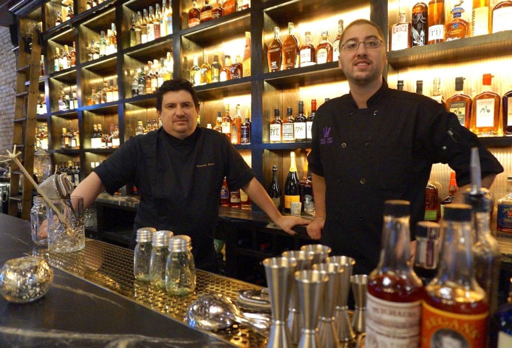 Executive Chef Alex Petard (left) and Chef de Cuisine Michael Voight stand behind the bar at Noble & Co., West Hartford's newest restaurant. Photo credit: Ronni Newton