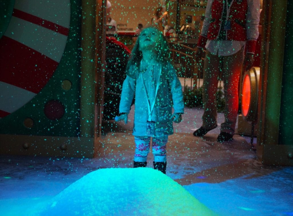 Emma Zoltobrzuch, 2, of Berlin is mesmerized by the falling "snow" at Westfarms. Photo credit: Ronni Newton