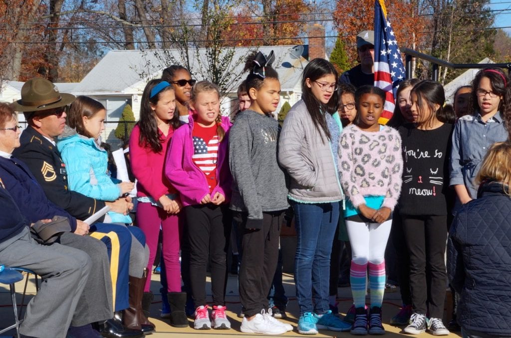 Fifth grade chorus sings 'America.' Veterans Day 2016. Photo credit: Ronni Newton