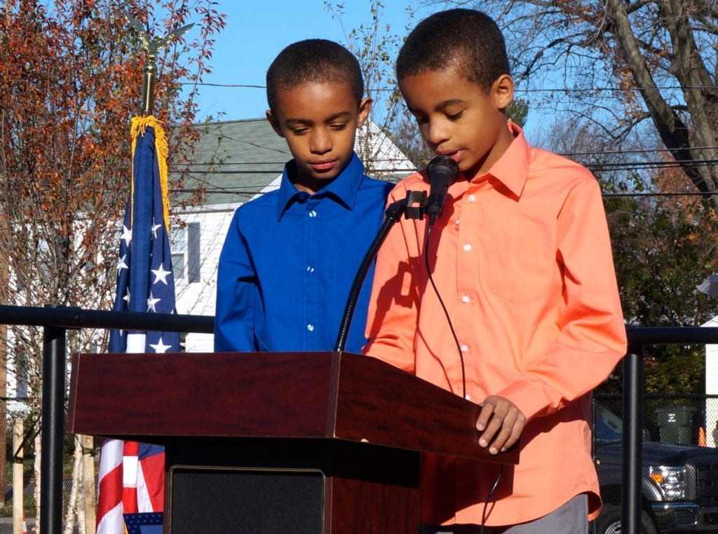 Twins Isaac and Elias Drummond give a tribute to Connie Nappier, late father of CT Treasurer Denise Nappier. Veterans Day 2016. Photo credit: Ronni Newton