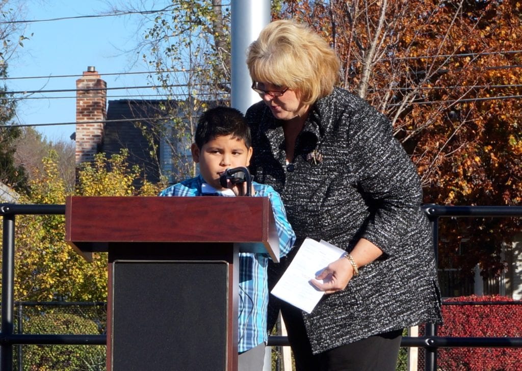 Organizer Janet Fournier with one of the students making a statement about bravery. Veterans Day 2016. Photo credit: Ronni Newton