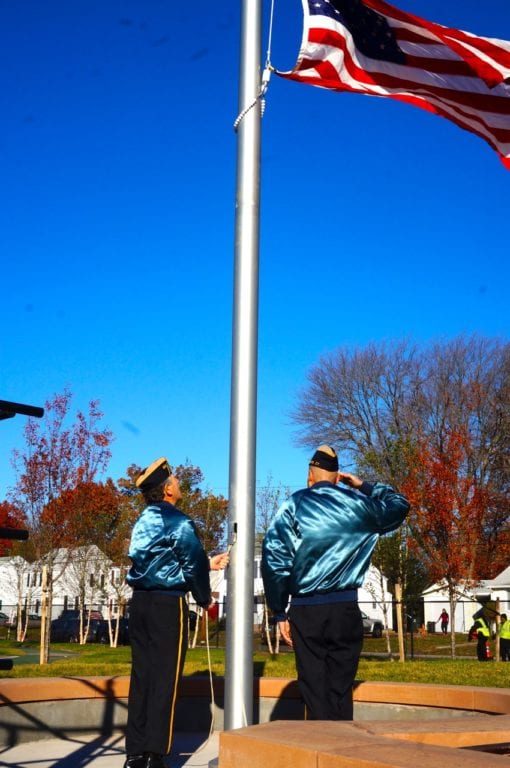 Michael DeLuca and Pat Harrell from the American Legion's Honor Guard raise the flag. Veterans Day 2016. Photo credit: Ronni Newton