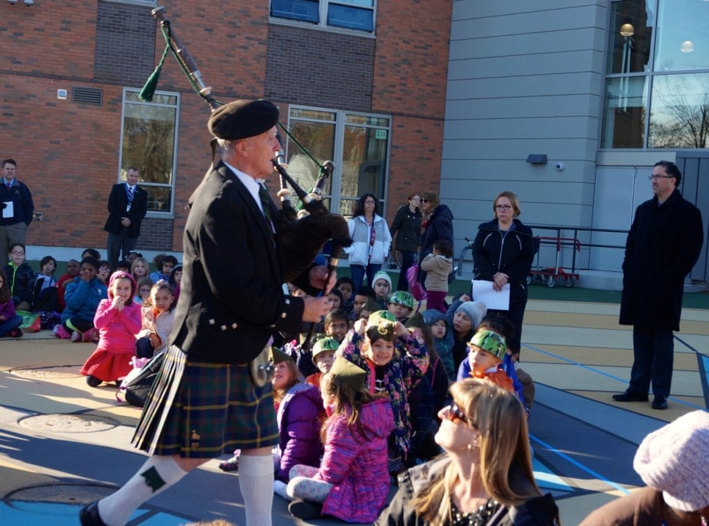Patrick Whalen plays the bagpipes as Charter Oak International Academy's program begins. Veterans Day 2016. Photo credit: Ronni Newton