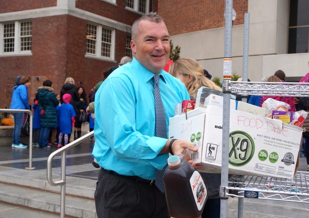 Asst. Superintendent Paul Vicinus helps bring the donated food into Town Hall. Morley Red Wagon Food Drive, Nov. 9, 2016. Photo credit: Ronni Newton