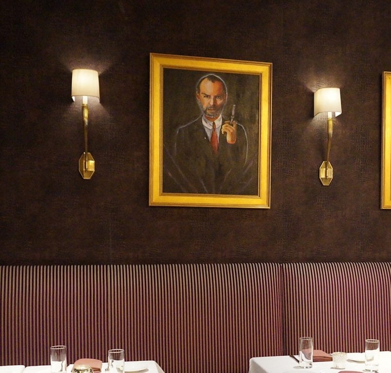 A painting of Steve Jobs – holding a gun – is one of the edgier elements in the Noble & Co. dining area. Photo credit: Ronni Newton
