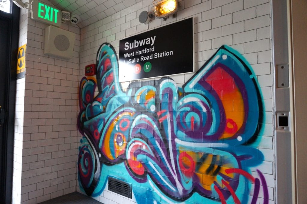 Graffiti covers the wall of the 'LaSalle Road Subway Station' – the hidden entrance to Noble & Co. Photo credit: Ronni Newton