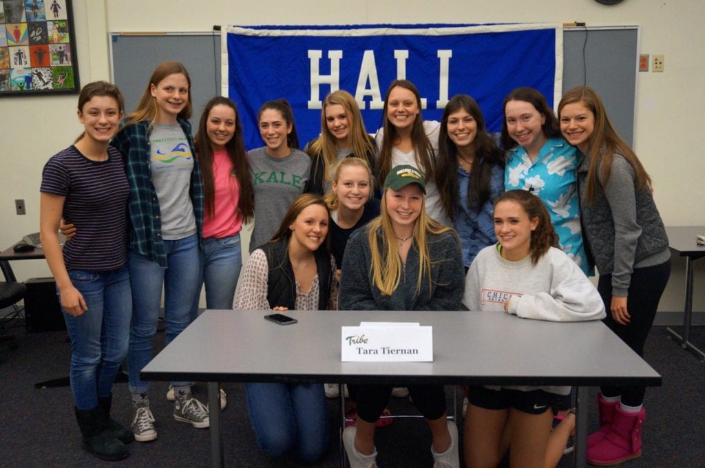 Tara Tiernan with other swim team members at the signing ceremony at Hall High School. Photo credit: Ronni Newton