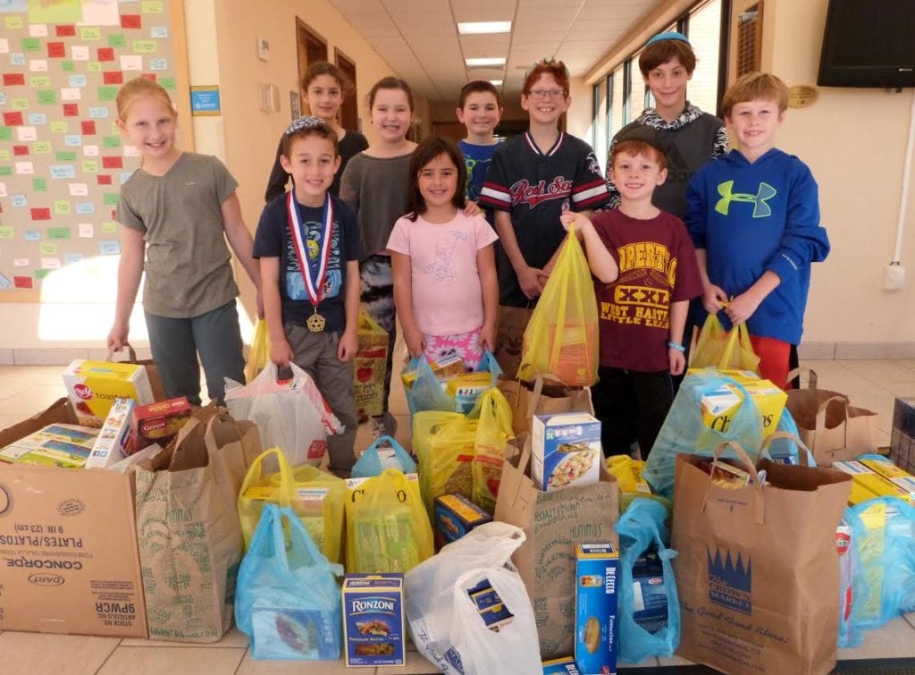 Solomon Schecter students with donations collected for the West Hartford Food Pantry. Submitted photo