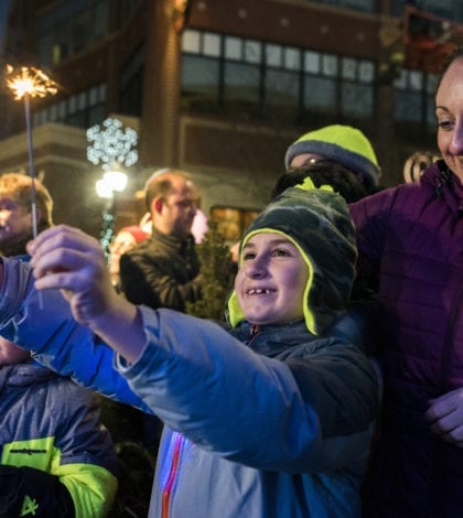 3-participants-join-in-lighting-up-the-night-as-the-8-foot-ice-menorah-is-lit